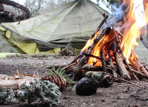 outdoor survival With a campfire and a tent. outdoor survival techniques.