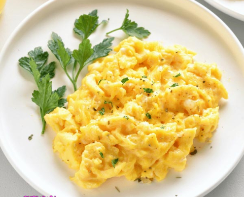 A plate of scrambled eggs from dehydrated powder food with some garnishing.